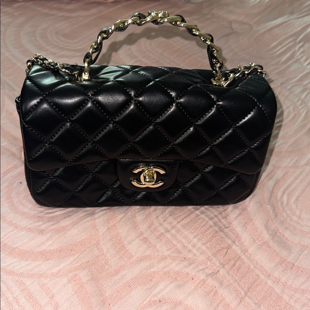 CHANEL Black Mini Bag with Gold Accents